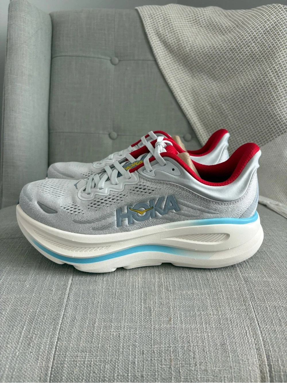 Hoka Women's Bondi 9 Light Gray Running Shoes with Red and Light Blue Accents